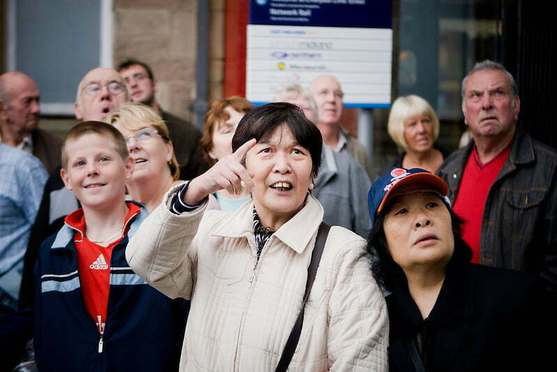 Liverpool wakes up to find a giant spider has appeared on the side of Concourse House by Lime Street Station. The expressions on peoples faces are priceless.  Wonder, confusion and curiosity. (Pete Carr)